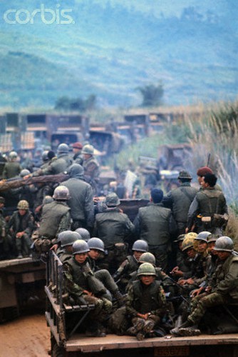07 Feb 1971, Near Khe Sanh, South Vietnam --- American and Vietnamese soldiers travel in personnel carriers during Operation Dewey Canyon II/Lam Son 719, which is aimed to reopen and secure Route 9 and reoccupy Khe Sanh as a forward supply base. --- Image by © Bettmann/CORBIS