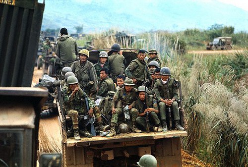 07 Feb 1971, Near Khe Sanh, South Vietnam --- Vietnamese soldiers travel in personnel carriers, part of a procession which also includes American troops, during Operation Dewey Canyon II/Lam Son 719, which is aimed to reopen and secure Route 9 and reoccupy Khe Sanh as a forward supply base. --- Image by © Bettmann/CORBIS