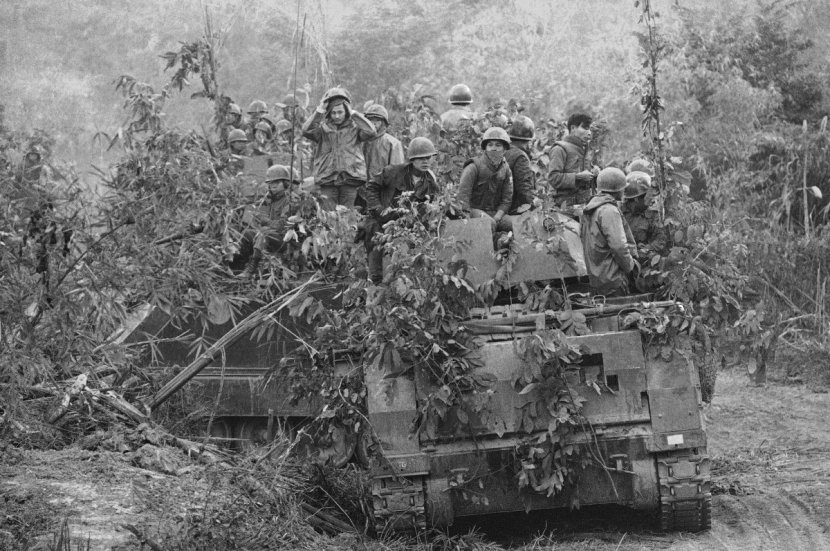 South Vietnamese armored personnel carrier, loaded with airborne troops, moves along Route 9 at Lang Vei, south Vietnam on Feb. 1971